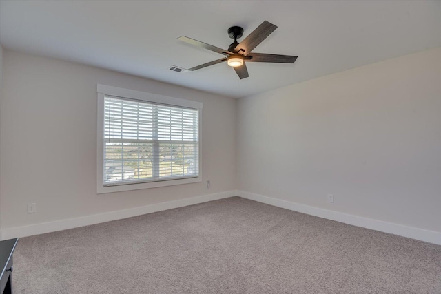 unfurnished room with ceiling fan and carpet floors