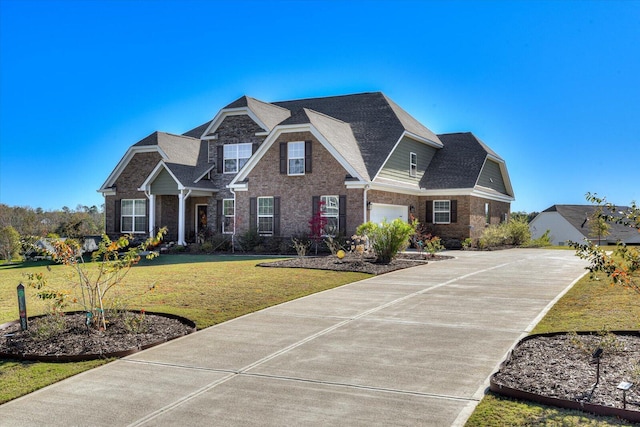 craftsman-style house with a garage and a front lawn