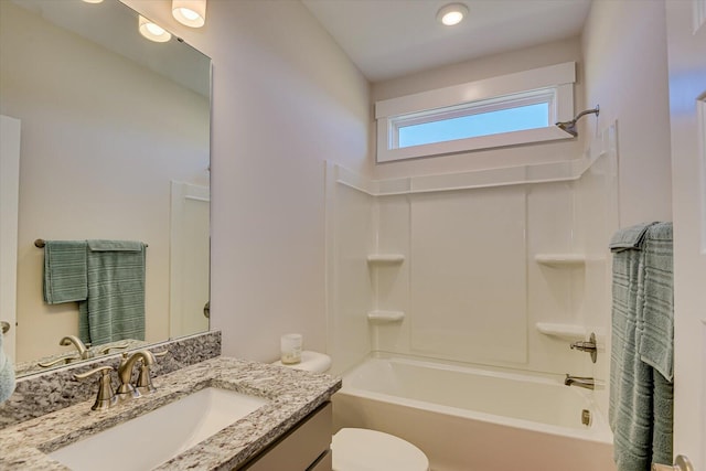 full bathroom featuring vanity,  shower combination, and toilet