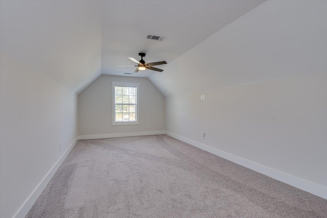 bonus room featuring light colored carpet, ceiling fan, and lofted ceiling