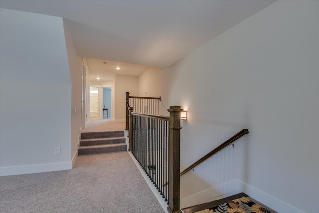 stairs featuring carpet