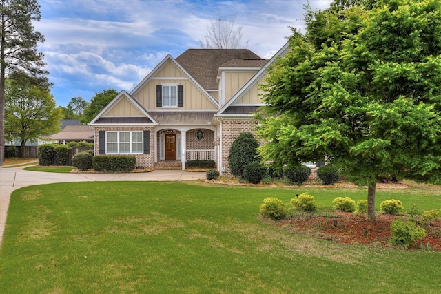 craftsman-style home with a front yard