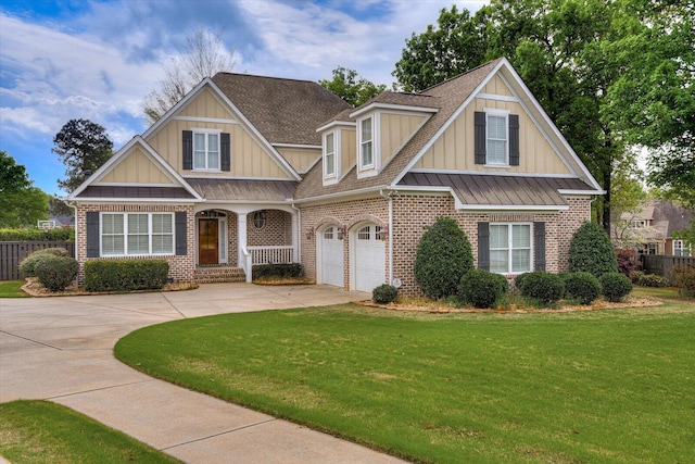 craftsman house with a garage and a front lawn