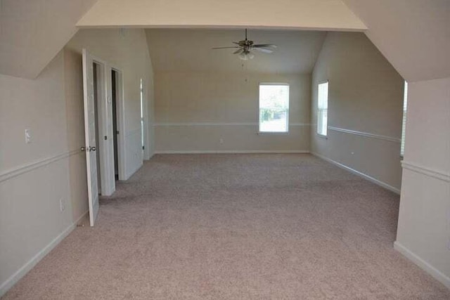 bonus room with ceiling fan, light colored carpet, and lofted ceiling