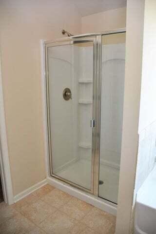 bathroom featuring an enclosed shower