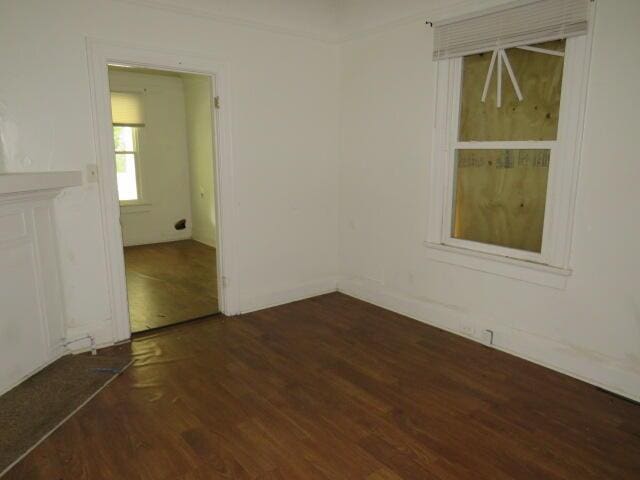 empty room featuring dark wood-type flooring