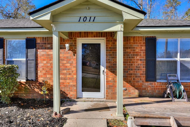 entrance to property with a deck