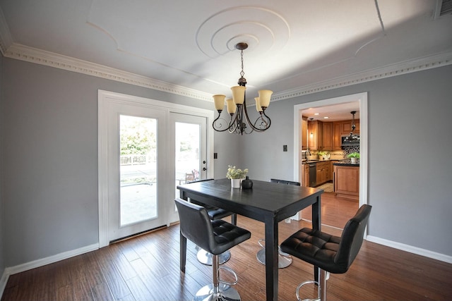 dining room with a chandelier and hardwood / wood-style flooring