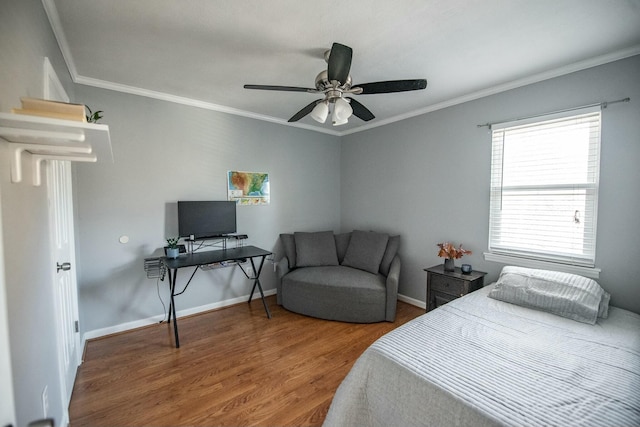 bedroom featuring hardwood / wood-style floors, ceiling fan, and ornamental molding