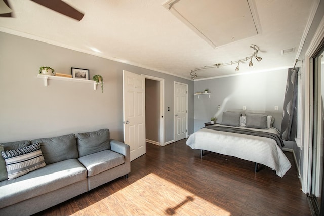 bedroom featuring dark hardwood / wood-style floors and ornamental molding