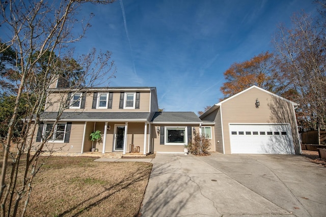 front facade featuring a front lawn and a garage