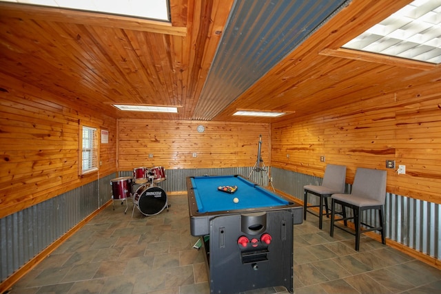 playroom featuring billiards, wooden ceiling, and wood walls