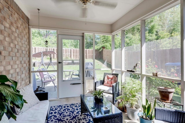 sunroom / solarium featuring an outdoor living space and ceiling fan