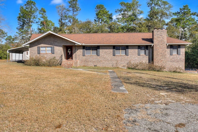 ranch-style house with a front lawn and a carport