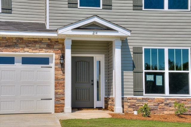 4062 Cottingham Way, Augusta, GA 30909 - property entrance with stone siding and a garage