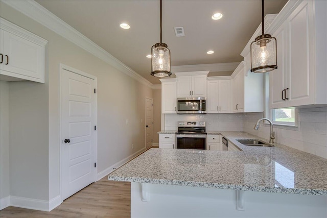 4062 Cottingham Way, Augusta, GA 30909 - kitchen featuring appliances with stainless steel finishes, a sink, crown molding, tasteful backsplash, and baseboards