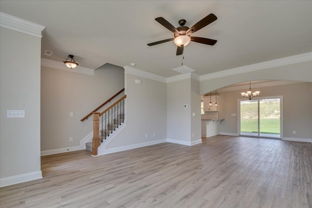 4062 Cottingham Way, Augusta, GA 30909 - unfurnished living room with ornamental molding, a chandelier, light wood finished floors, a ceiling fan, and arched walkways
