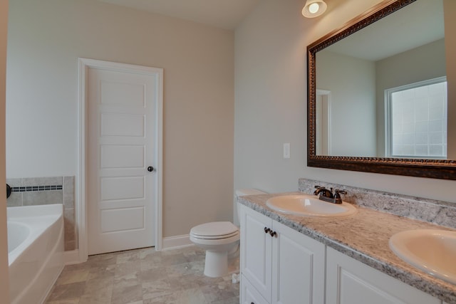 4062 Cottingham Way, Augusta, GA 30909 - bathroom with a garden tub, double vanity, toilet, and baseboards