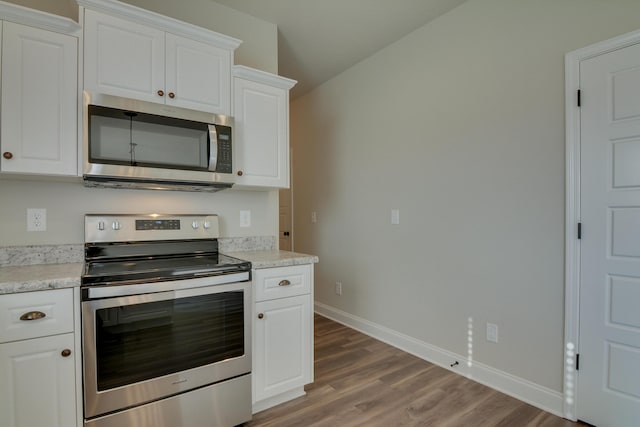 4062 Cottingham Way, Augusta, GA 30909 - kitchen featuring stainless steel appliances, baseboards, light wood finished floors, and white cabinets