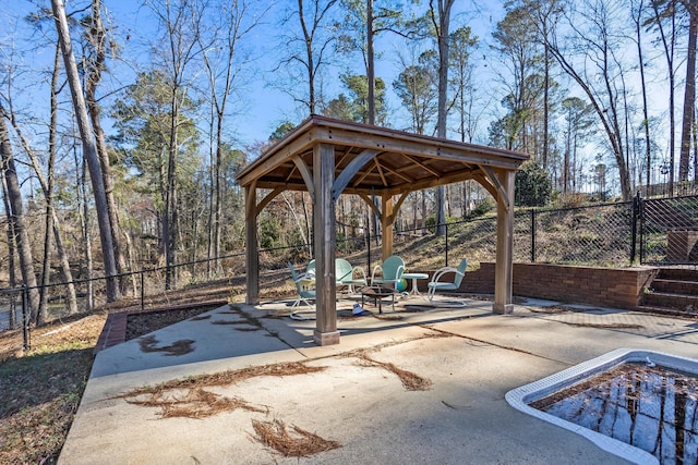 view of patio / terrace with fence and a gazebo