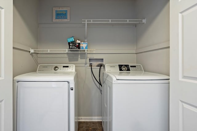 washroom featuring laundry area and washing machine and clothes dryer