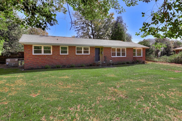 ranch-style home with a front lawn