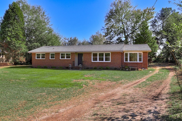 ranch-style home featuring a front yard