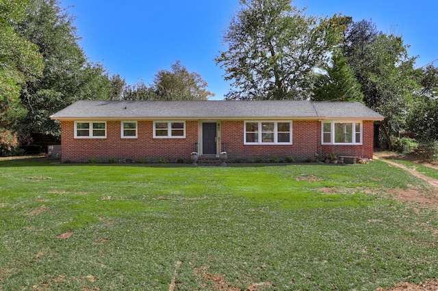 single story home featuring a front lawn