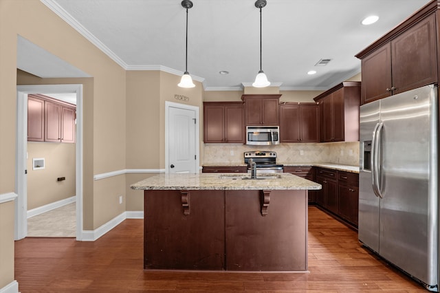 436 Sebastian Dr, Grovetown, GA 30813 - kitchen with appliances with stainless steel finishes, decorative backsplash, dark brown cabinets, light stone countertops, and crown molding