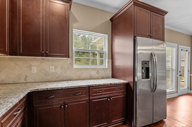 436 Sebastian Dr, Grovetown, GA 30813 - kitchen featuring stainless steel fridge, crown molding, decorative backsplash, wood finished floors, and light stone counters