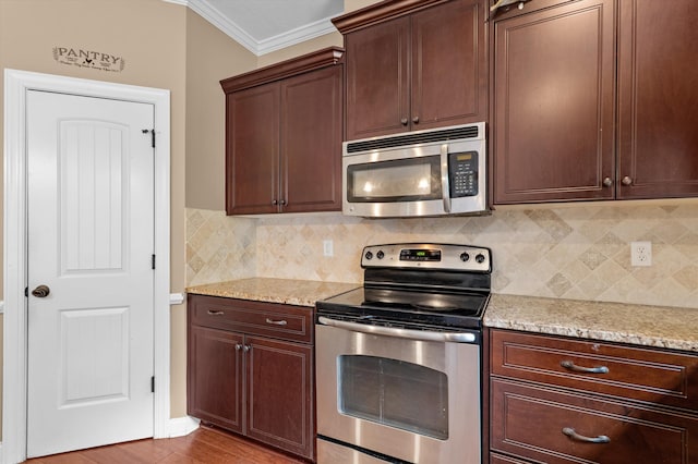 436 Sebastian Dr, Grovetown, GA 30813 - kitchen featuring stainless steel appliances, backsplash, ornamental molding, light stone countertops, and dark brown cabinets