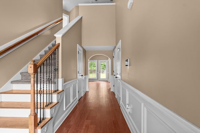 436 Sebastian Dr, Grovetown, GA 30813 - foyer entrance with a decorative wall, a wainscoted wall, a high ceiling, stairs, and dark wood-type flooring