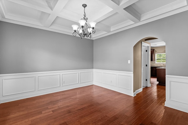 436 Sebastian Dr, Grovetown, GA 30813 - empty room with arched walkways, a chandelier, coffered ceiling, wood finished floors, and beamed ceiling
