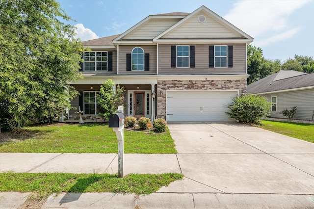 436 Sebastian Dr, Grovetown, GA 30813 - view of front of house featuring driveway, covered porch, a front lawn, an attached garage, and stone siding