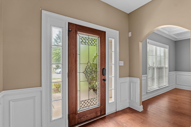 436 Sebastian Dr, Grovetown, GA 30813 - foyer entrance featuring arched walkways, wainscoting, wood finished floors, a decorative wall, and ornamental molding