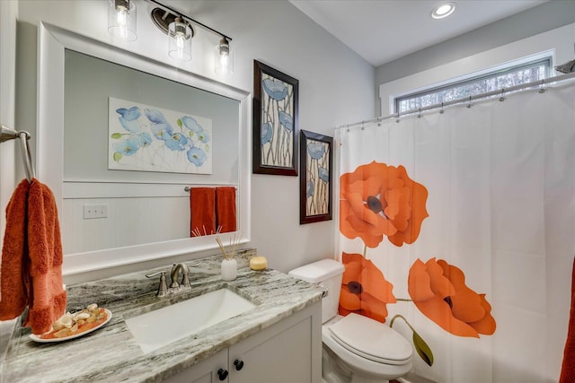 full bath featuring vanity, curtained shower, and toilet