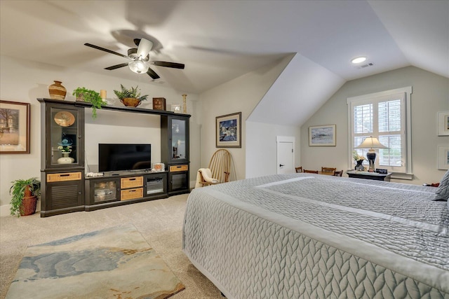 bedroom featuring visible vents, lofted ceiling, ceiling fan, and carpet flooring