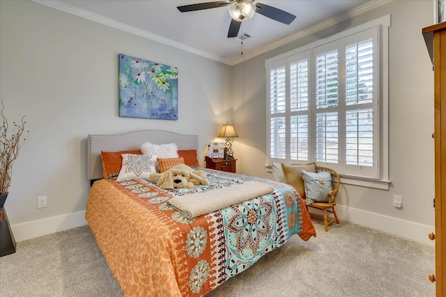 carpeted bedroom featuring visible vents, baseboards, a ceiling fan, and crown molding