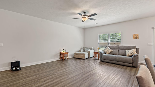 4756 Storey Mill Rd, Hephzibah, GA 30815 - living area with wood finished floors, ceiling fan, baseboards, and a textured ceiling