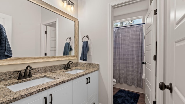 4756 Storey Mill Rd, Hephzibah, GA 30815 - full bath with toilet, wood finished floors, and double vanity