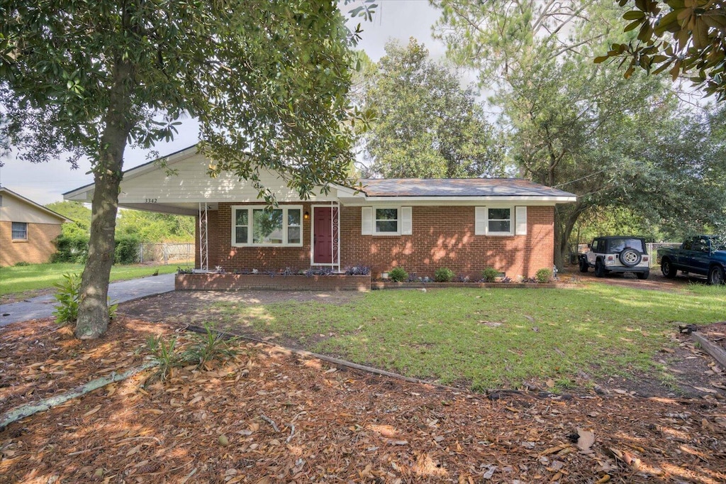3342 Fashion Dr, Augusta, GA 30906 - single story home with a front yard, a carport, brick siding, and driveway