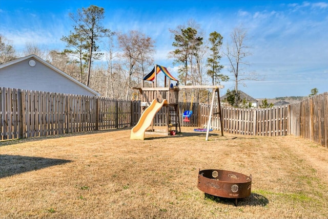 view of jungle gym with a fenced backyard and a yard