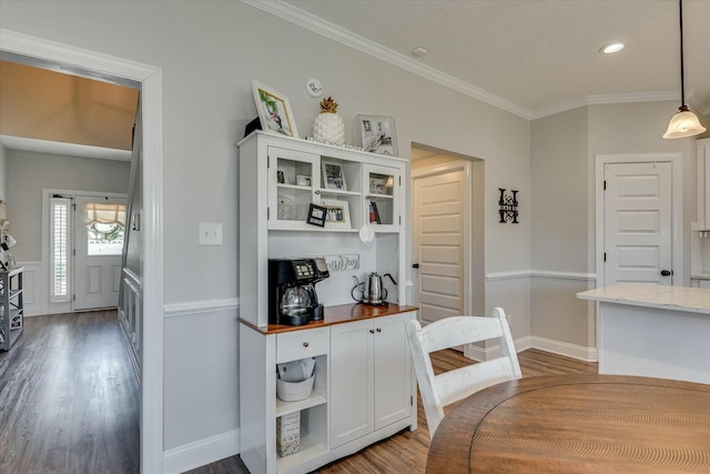 interior space with recessed lighting, wood finished floors, baseboards, and ornamental molding