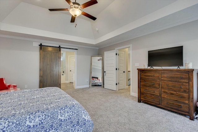 bedroom with crown molding, a barn door, vaulted ceiling, carpet floors, and a raised ceiling