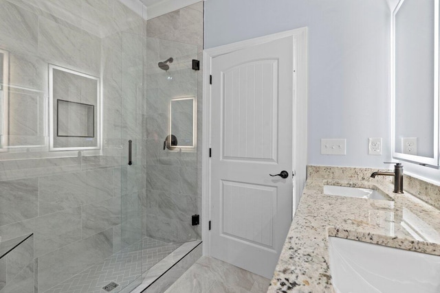 bathroom featuring vanity and an enclosed shower