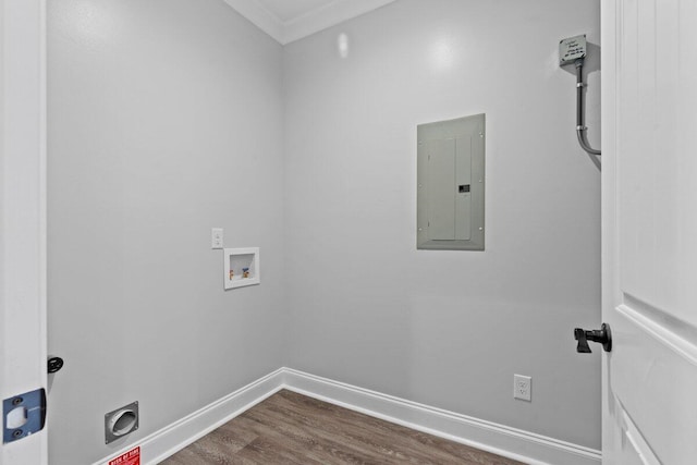 clothes washing area featuring hookup for a washing machine, dark hardwood / wood-style flooring, ornamental molding, and electric panel