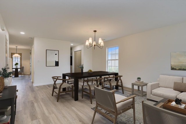 dining room featuring a chandelier and light hardwood / wood-style floors