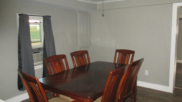 dining area featuring dark hardwood / wood-style floors