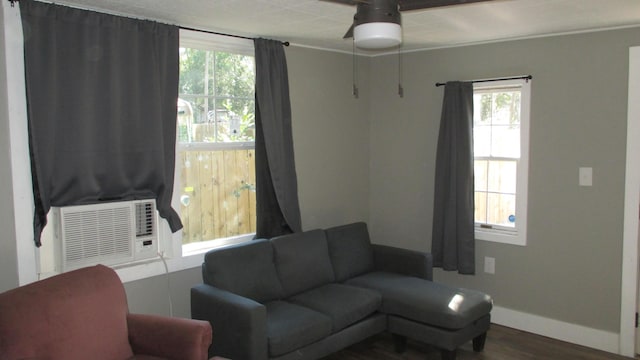 living room featuring ceiling fan, hardwood / wood-style floors, and cooling unit