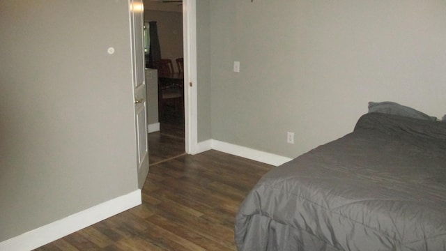 bedroom featuring dark wood-type flooring